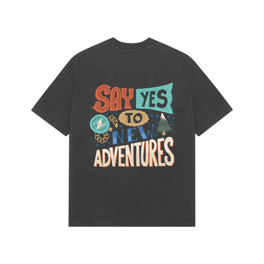 Black Kayzen Say Yes to New Adventures Oversized
Heavyweight T-Shirt - multicolour travel adventure
compass tree typography quote graphic back print on
dark contrast base | Buy premium oversized graphic tee
India